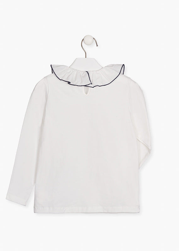 Blusa  con volante en cuello.